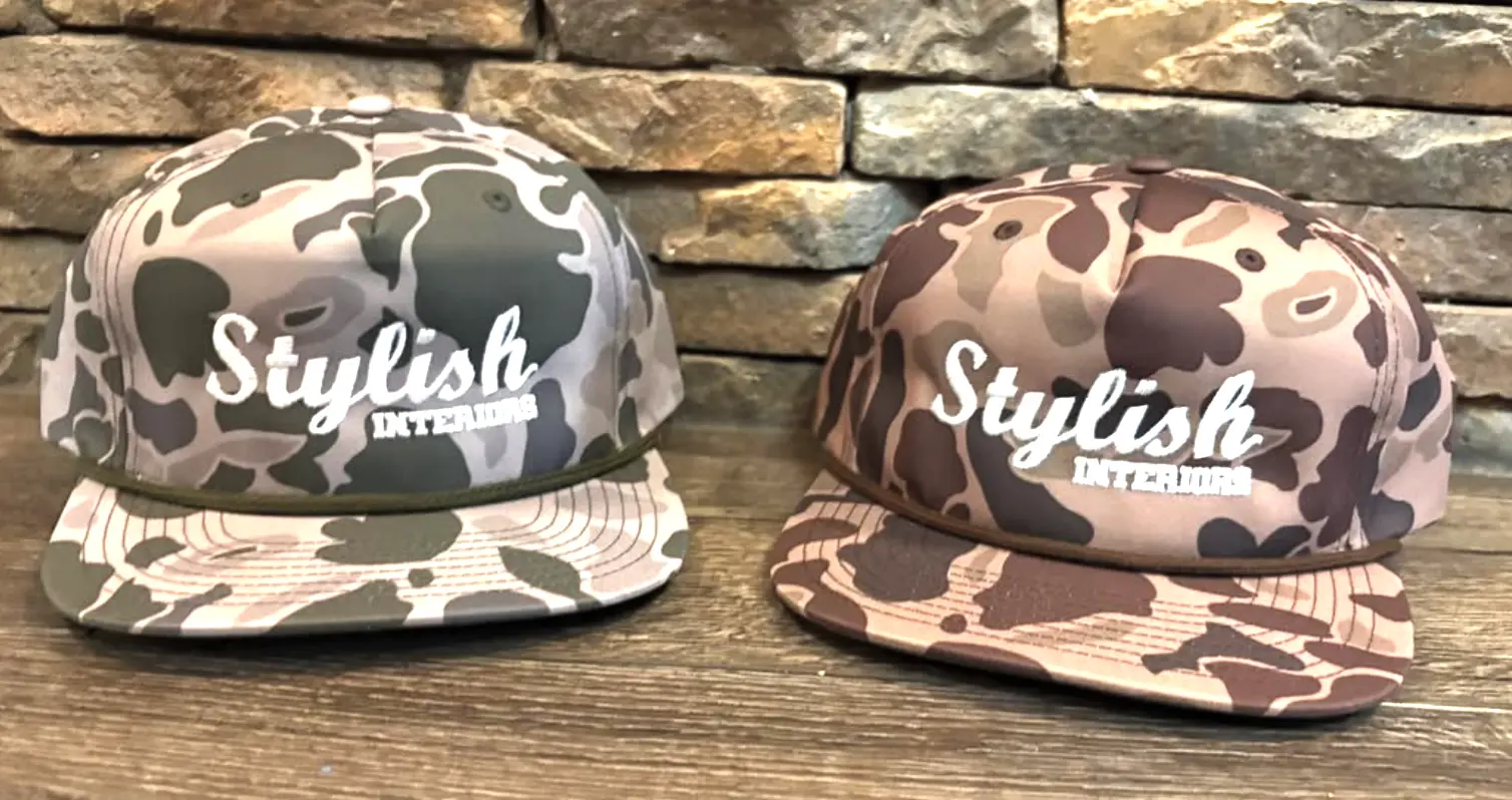 Two camo caps with white Stylish Interiors embroidery